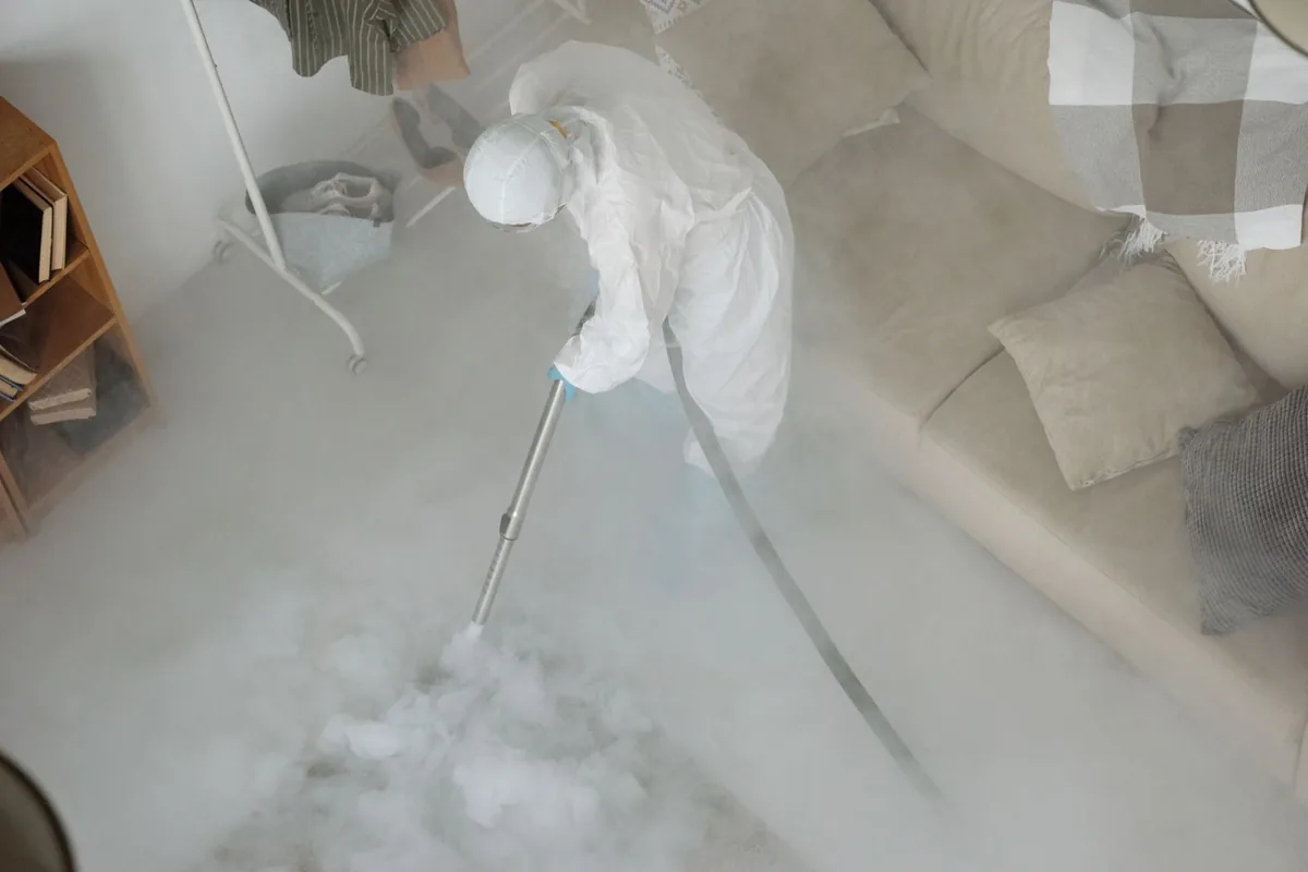 Biohazard cleanup technician in protective equipment, Menard, TX